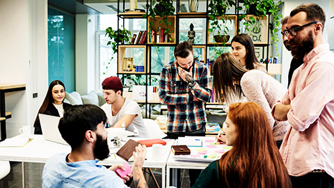 A team of young professionals holding a meeting in their co-working space