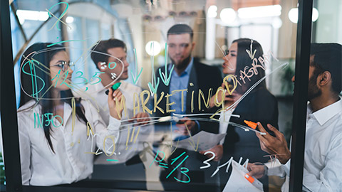 A team aligning their list of cloud-based features to a marketing plan