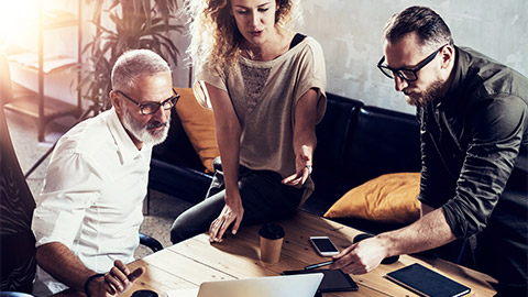 A group of people developing a proposal for the Cloud