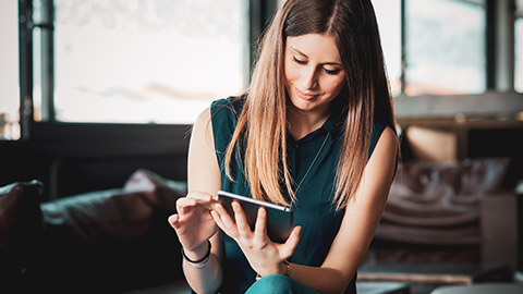 A young accountant checking if macros are working correctly on a tablet device