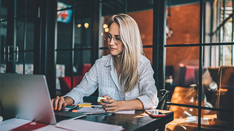 A person working in front of a laptop in an office