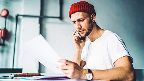 A professional reviewing an employment contract as part of a job offer made to them