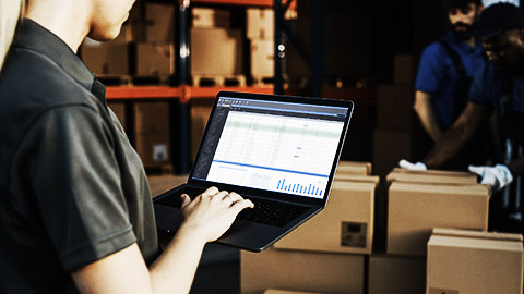 A warehouse manager taking stock of yet to be deployed computers