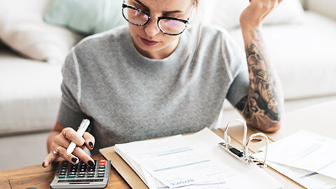 A business owner paying bills