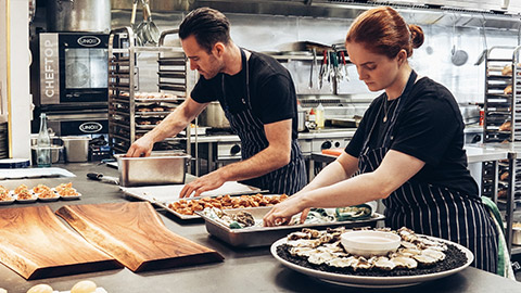 Restaurant workers preparing food