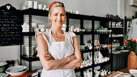 A small business owner in their pottery studio