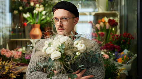 A hipster florist in his shop