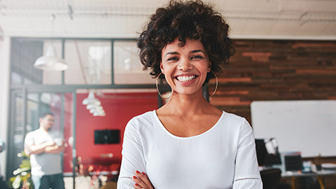 A smiling business professional in an office environment