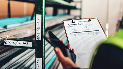 An employee gathering stock in a warehouse