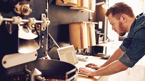 A small business owner setting up accounting software on a laptop