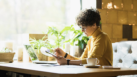 Young businessperson reviewing an academic document