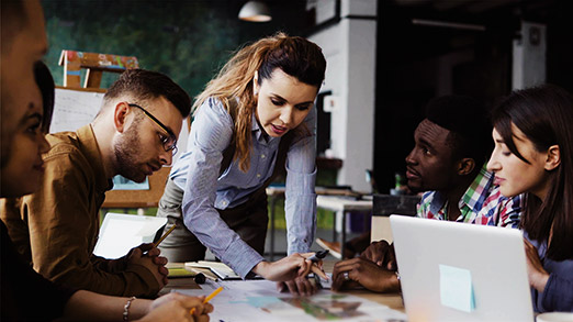 a group of individuals hacing a discussion lead by a business manager