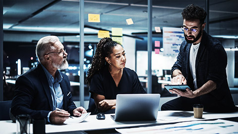 A group of data analysts discussing a set of newl acquired information