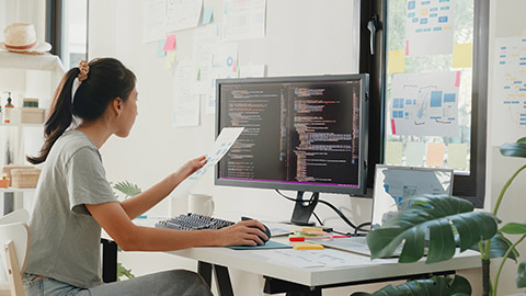 Side view of professional young Asia girl IT development programmer