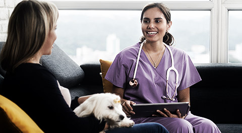 A new client talking to a veterinary receptionist