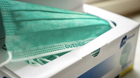 A close view of a box of disposable masks