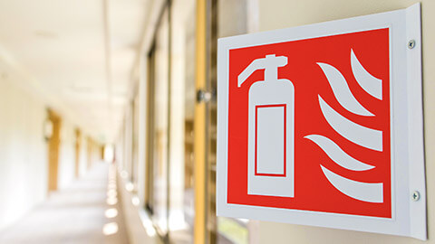 A close view of a fire extinguisher sign