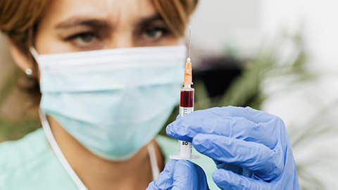 A close view of a vet nurse wearing PPE