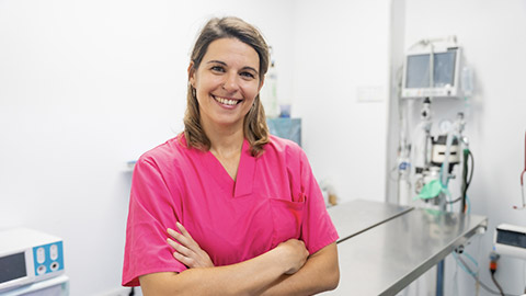 Portrait of a young female veterinarian at the vet clinic, arms crossed