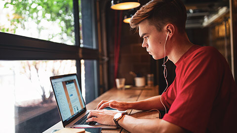 A designer working on a website on a laptop