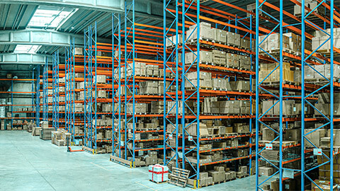 A warehouse filled with large, cardboard boxes