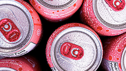 A top view of ice-cold canned beverages