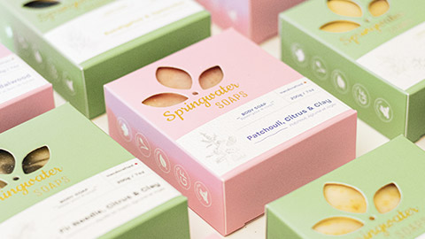 A spread of soaps in various packaging types