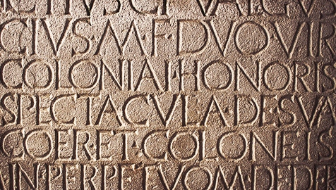 latin characters carved in stone