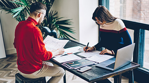 2 designers gathering information for a design project