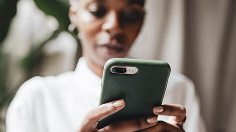 A close view of a person accessing a website on a phone