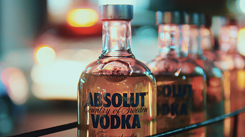 A close view of bottles of Absolut vodka