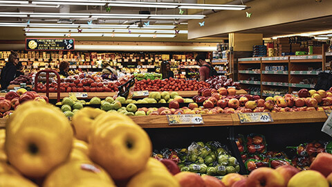 A wide view of a grocery store with a variety of locally sourced products