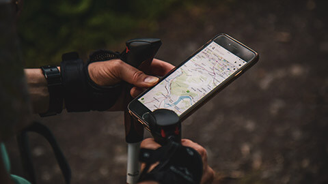 A close view of person using GoogleMaps while hiking