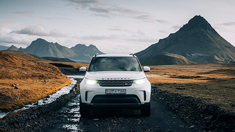 a wide shot of a Landrover Discovery