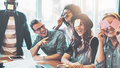 A jovial group of coworkers in an office