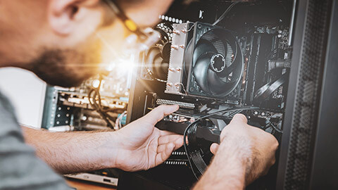 A technician replacing a power unit