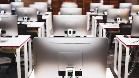 A room filled with desktop computers