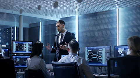 Supervisor Holds Briefing for His Employees in System Control Center