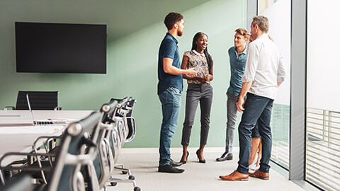 A work group having a standup meeting