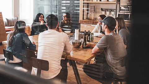 A work group having a relaxed discussion in a lunch room