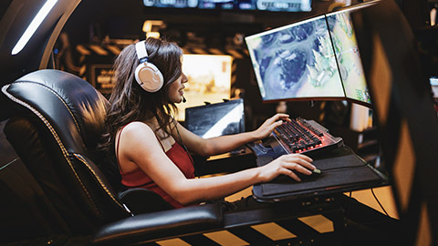 A gamer sitting in a motion-simulator gaming chair