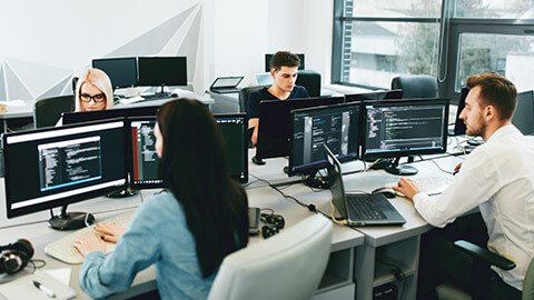 A wide shot of an office with multiple computers