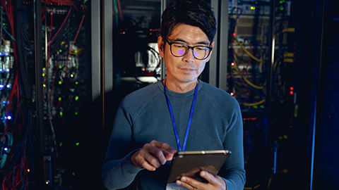 An IT network manager in a server room