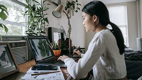 A person doing illustation on a drawing tablet