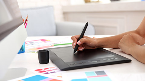 A person using a drawing tablet