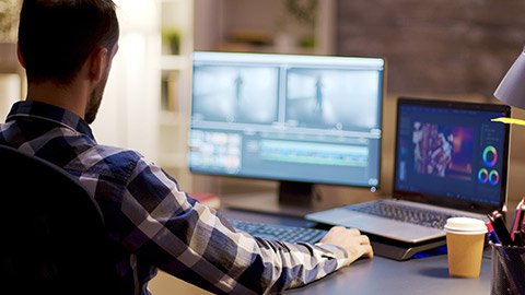 An animator at work on multiple screens