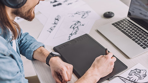 An animator working on a laptop