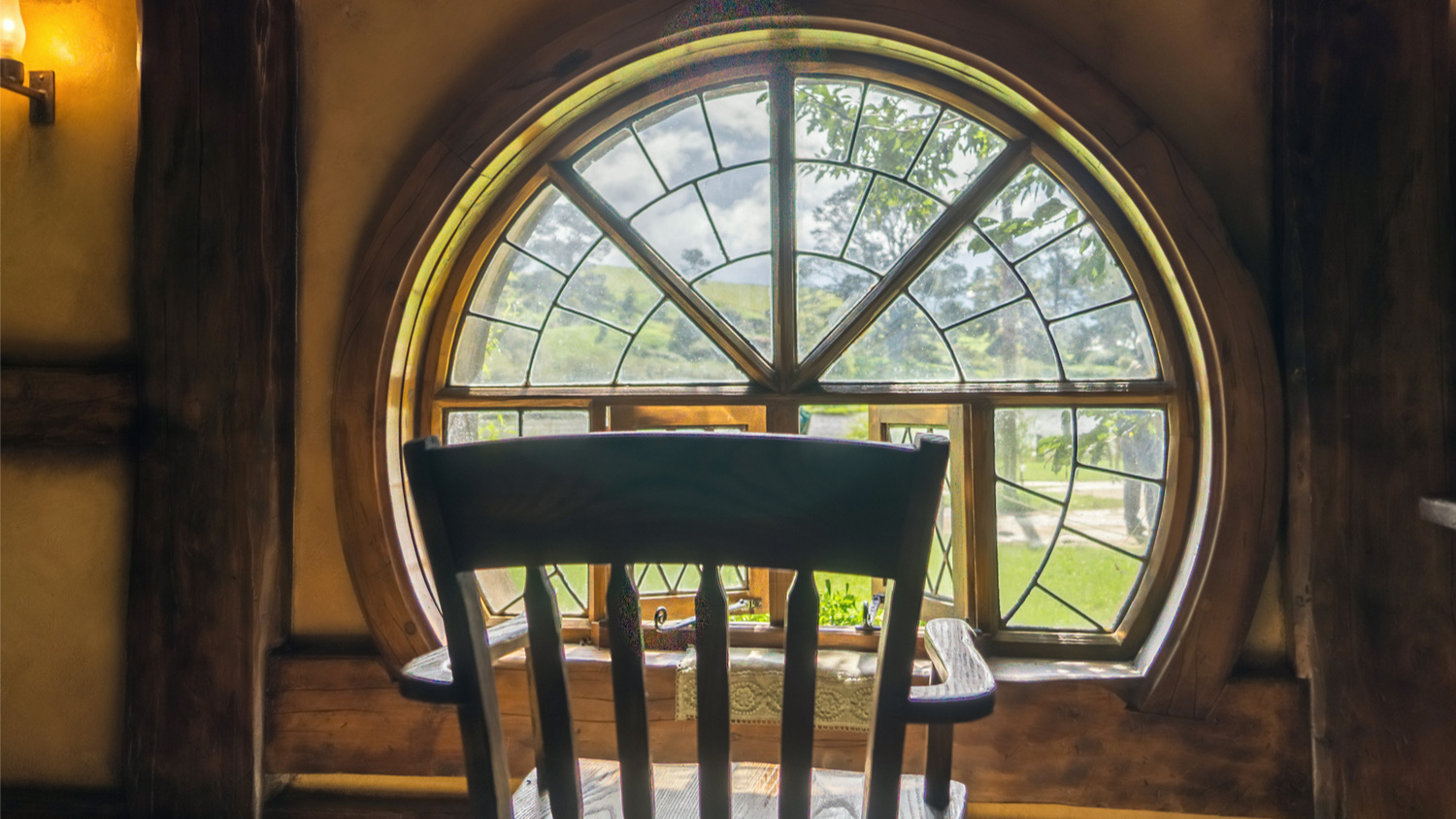 A chair facing the window, looking out of the Green Dragon.