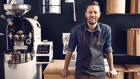 A sole trader in his coffee roasting business