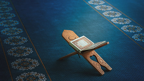 Quran sitting on a stand in a mosque